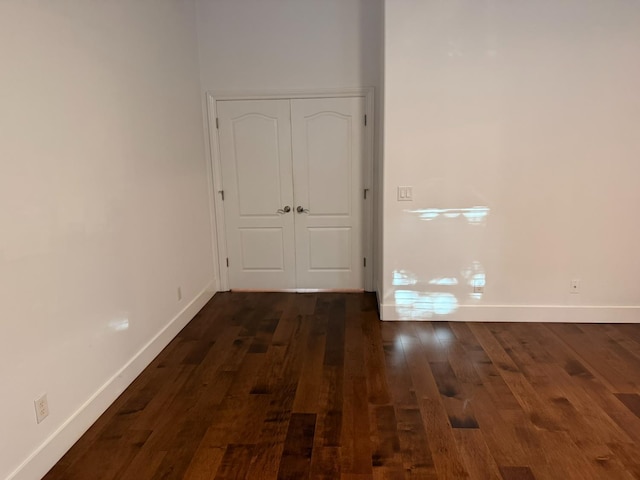 9850 N Winery Ave, Fresno, CA 93720 - empty room with baseboards and dark wood-style flooring