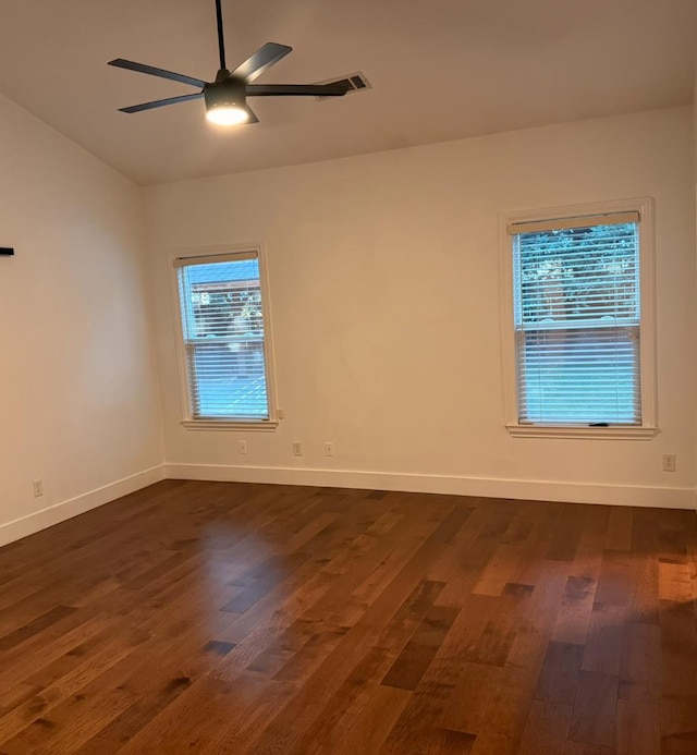 9850 N Winery Ave, Fresno, CA 93720 - spare room with dark wood finished floors, a ceiling fan, vaulted ceiling, and baseboards