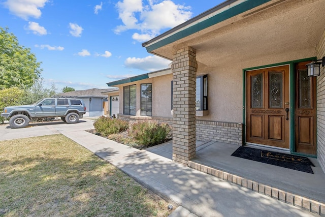 300 W Adrian Way, Hanford, CA 93230 - entrance to property with stucco siding and a lawn