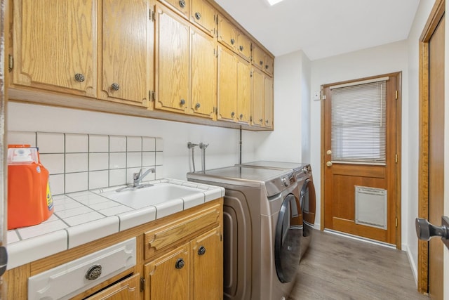 300 W Adrian Way, Hanford, CA 93230 - washroom with cabinet space, washer and clothes dryer, wood finished floors, baseboards, and heating unit