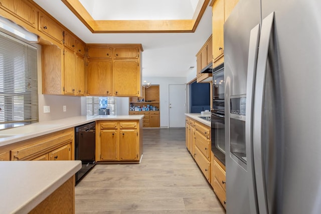 300 W Adrian Way, Hanford, CA 93230 - kitchen featuring black appliances, light countertops, light wood-style flooring, and a peninsula