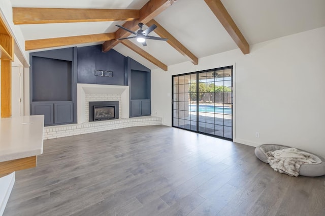 300 W Adrian Way, Hanford, CA 93230 - unfurnished living room with ceiling fan, wood finished floors, a brick fireplace, and baseboards