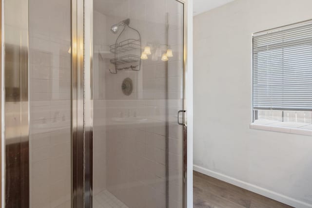300 W Adrian Way, Hanford, CA 93230 - full bathroom featuring baseboards, a shower stall, and wood finished floors