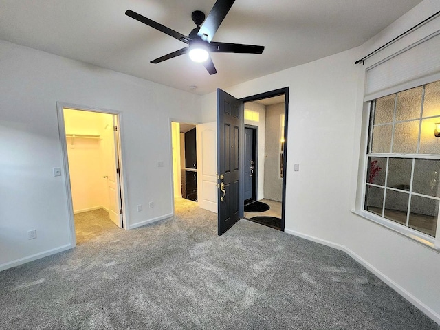9438 N Ann Ave, Fresno, CA 93720 - unfurnished bedroom featuring carpet flooring, baseboards, a spacious closet, and a ceiling fan