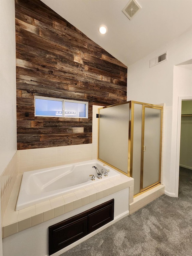 9438 N Ann Ave, Fresno, CA 93720 - full bathroom with vaulted ceiling, wooden walls, a shower stall, a bath, and recessed lighting