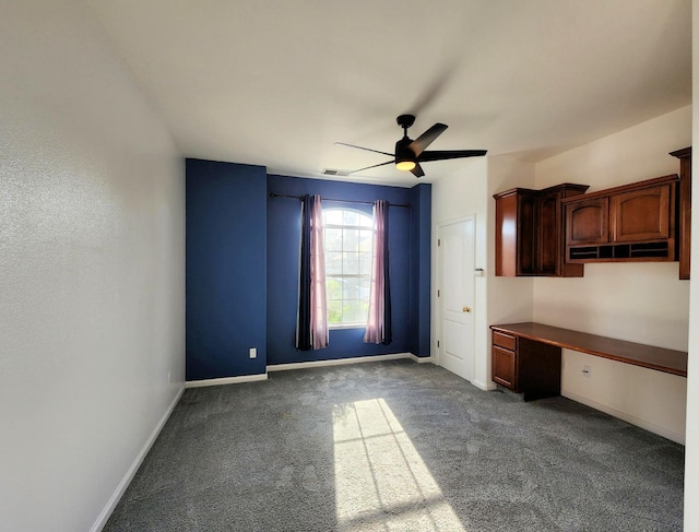 9438 N Ann Ave, Fresno, CA 93720 - unfurnished office with built in desk, ceiling fan, carpet floors, and baseboards