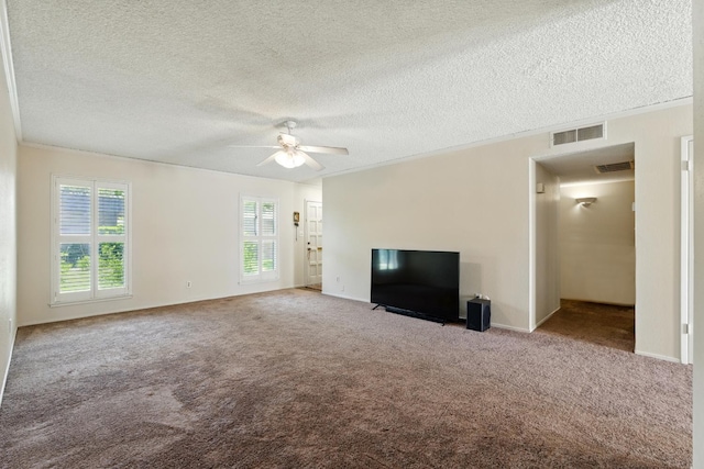 4849 N 7th St Unit E, Fresno, CA 93726 - unfurnished living room with carpet, healthy amount of natural light, ceiling fan, and a textured ceiling