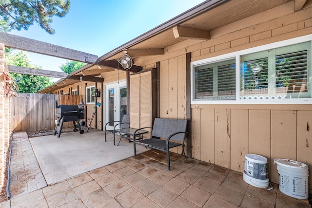 4849 N 7th St Unit E, Fresno, CA 93726 - view of patio / terrace featuring french doors and a grill