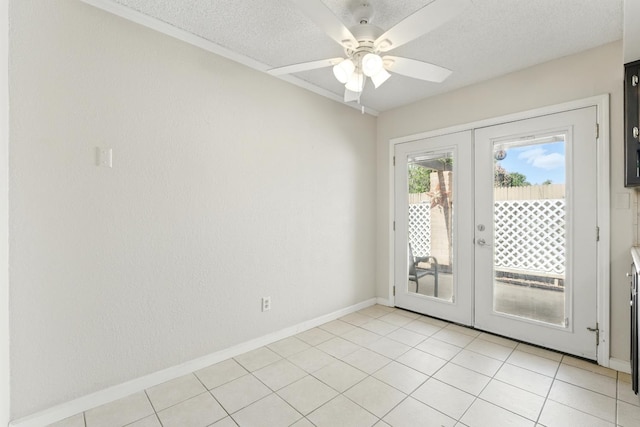 4849 N 7th St Unit E, Fresno, CA 93726 - unfurnished room featuring french doors, a ceiling fan, baseboards, and light tile patterned floors