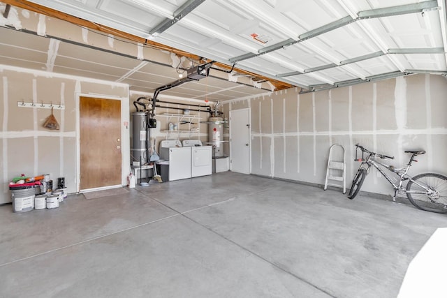 1226 Summer Field Dr, Hanford, CA 93230 - garage with washer and clothes dryer, strapped water heater, and water heater