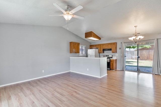 1226 Summer Field Dr, Hanford, CA 93230 - unfurnished living room with a chandelier, light wood finished floors, vaulted ceiling, baseboards, and ceiling fan
