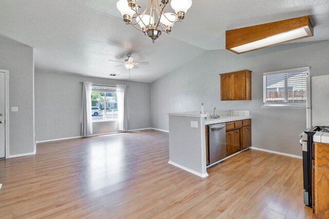 1226 Summer Field Dr, Hanford, CA 93230 - kitchen with dishwasher, range, brown cabinets, freestanding refrigerator, and a peninsula