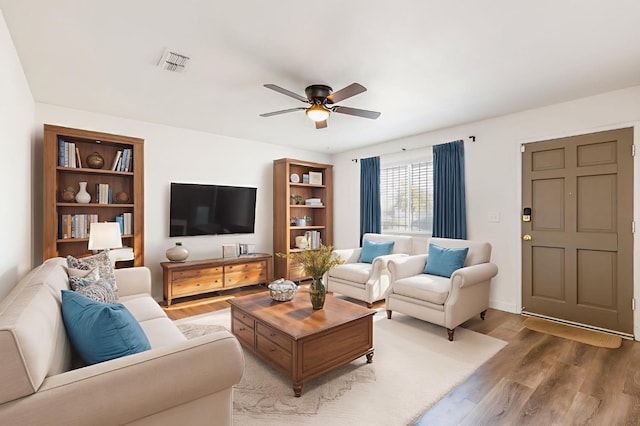 4003 E El Monte Way, Fresno, CA 93702 - living area featuring wood finished floors and ceiling fan