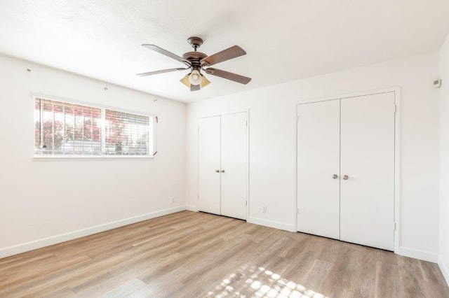 4003 E El Monte Way, Fresno, CA 93702 - unfurnished bedroom with multiple closets, light wood-style floors, baseboards, and a ceiling fan