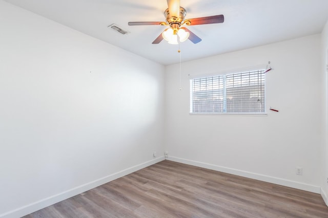 4003 E El Monte Way, Fresno, CA 93702 - empty room featuring baseboards, a ceiling fan, and wood finished floors