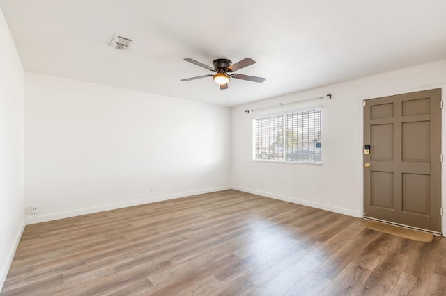 4003 E El Monte Way, Fresno, CA 93702 - unfurnished room with ceiling fan, wood finished floors, and baseboards