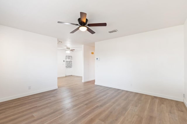4003 E El Monte Way, Fresno, CA 93702 - spare room with a ceiling fan, light wood-type flooring, and baseboards