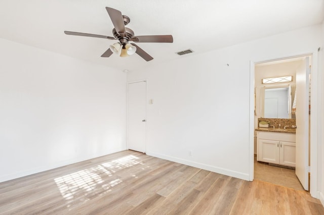 4003 E El Monte Way, Fresno, CA 93702 - unfurnished bedroom featuring light wood-style floors, baseboards, ensuite bath, and a ceiling fan
