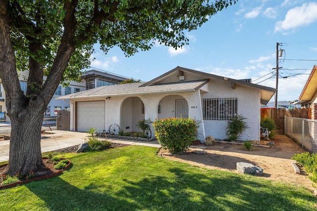 4003 E El Monte Way, Fresno, CA 93702 - bungalow-style house featuring stucco siding, an attached garage, and driveway
