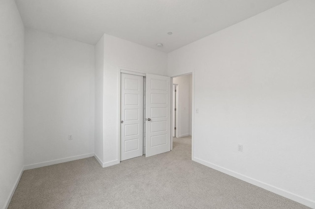 3210 Frontera Ave, Clovis, CA 93619 - unfurnished bedroom with light carpet, baseboards, and a closet