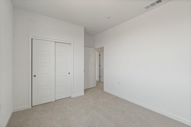 3210 Frontera Ave, Clovis, CA 93619 - unfurnished bedroom with carpet flooring, baseboards, and a closet