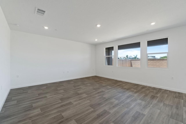 3210 Frontera Ave, Clovis, CA 93619 - spare room with wood finished floors, recessed lighting, and baseboards