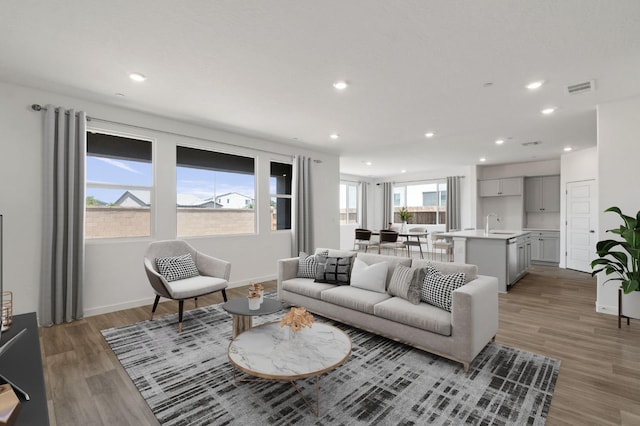 3210 Frontera Ave, Clovis, CA 93619 - living area featuring recessed lighting, light wood finished floors, and baseboards