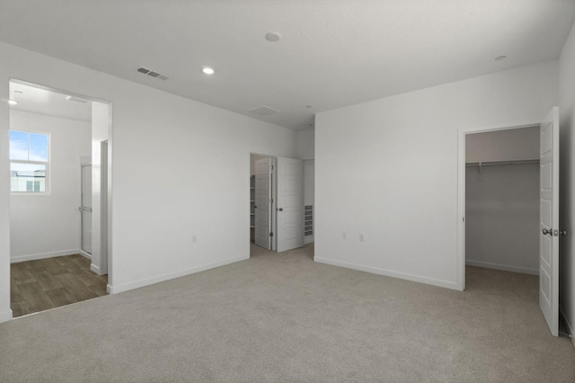 3210 Frontera Ave, Clovis, CA 93619 - unfurnished bedroom featuring a spacious closet, carpet, baseboards, a closet, and recessed lighting