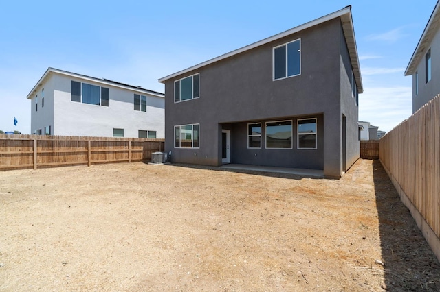 3210 Frontera Ave, Clovis, CA 93619 - rear view of property with cooling unit, stucco siding, and a fenced backyard