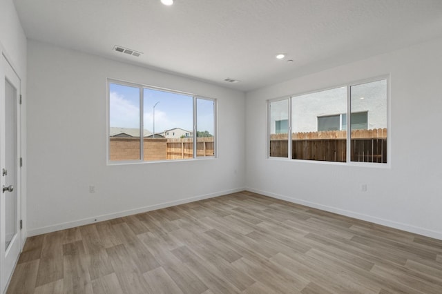 3210 Frontera Ave, Clovis, CA 93619 - unfurnished room with light wood-type flooring, baseboards, and recessed lighting