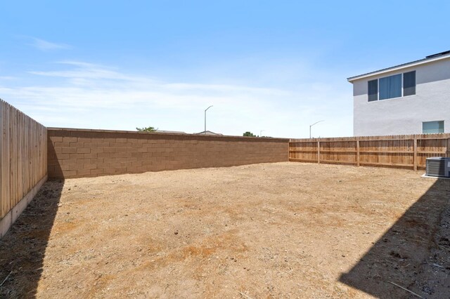 3210 Frontera Ave, Clovis, CA 93619 - fenced backyard featuring central air condition unit