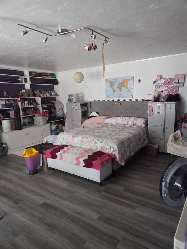 4531 E Fedora Ave, Fresno, CA 93726 - bedroom with wood finished floors, a textured ceiling, and rail lighting