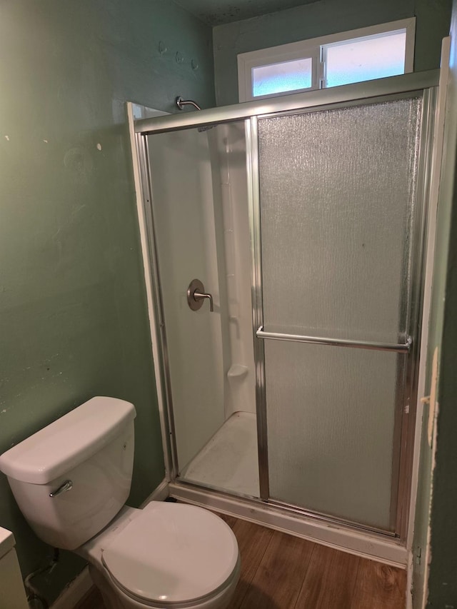 4531 E Fedora Ave, Fresno, CA 93726 - bathroom featuring wood finished floors, toilet, and a shower stall