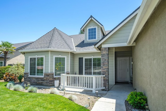 578 W Serena Ave, Clovis, CA 93619 - view of exterior entry with stone siding and roof with shingles