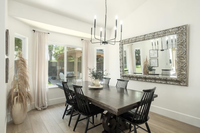 578 W Serena Ave, Clovis, CA 93619 - dining space with light wood-type flooring and a chandelier