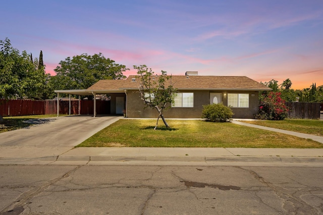 1808 Jenning St, Mendota, CA 93640 - ranch-style home featuring stucco siding, an attached carport, and driveway