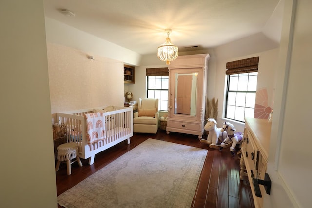 2210 W Spruce Ave, Fresno, CA 93711 - bedroom featuring a chandelier and dark wood-type flooring