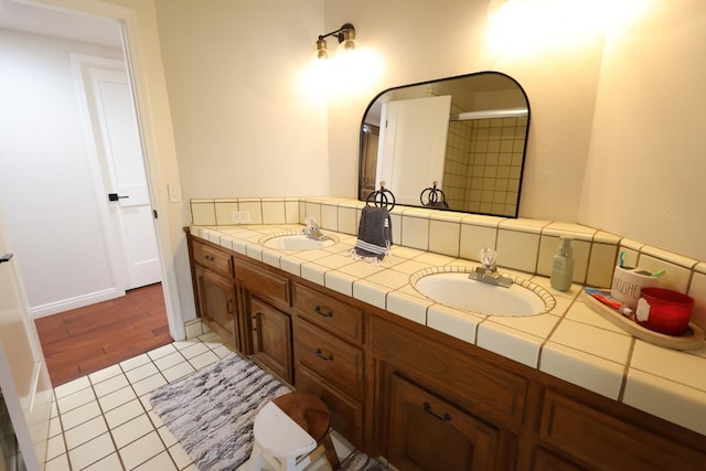 2210 W Spruce Ave, Fresno, CA 93711 - full bathroom featuring double vanity, tile patterned flooring, and a shower