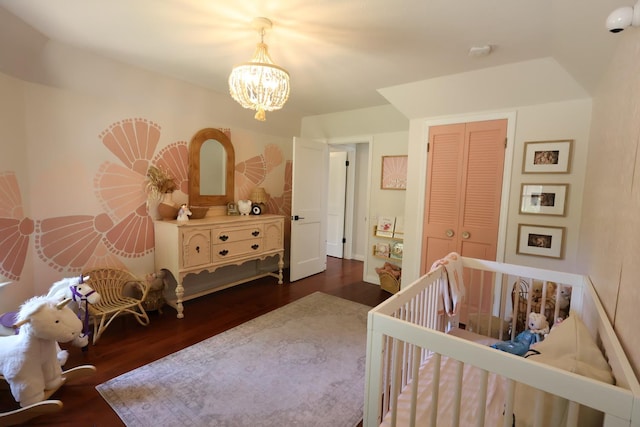 2210 W Spruce Ave, Fresno, CA 93711 - bedroom with a chandelier, dark wood-type flooring, and a closet