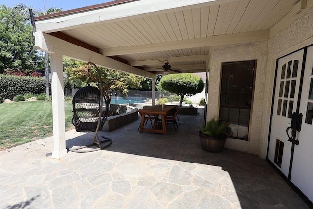 2210 W Spruce Ave, Fresno, CA 93711 - fenced backyard with a patio, ceiling fan, and outdoor dining space