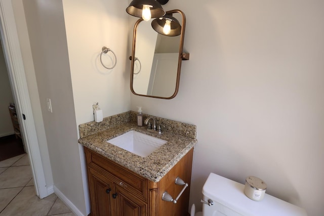2210 W Spruce Ave, Fresno, CA 93711 - bathroom featuring toilet, vanity, and tile patterned flooring