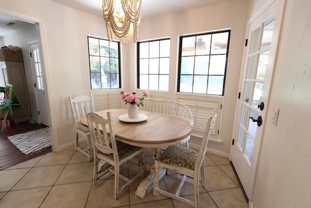 2210 W Spruce Ave, Fresno, CA 93711 - dining space featuring a chandelier, baseboards, and light tile patterned floors