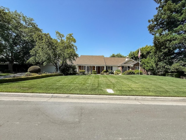 2210 W Spruce Ave, Fresno, CA 93711 - ranch-style house with a front lawn