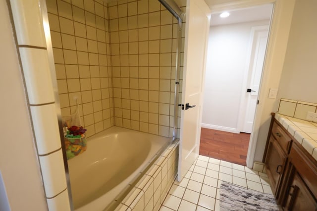 2210 W Spruce Ave, Fresno, CA 93711 - full bathroom with tile patterned flooring, baseboards, vanity, tiled shower / bath, and recessed lighting