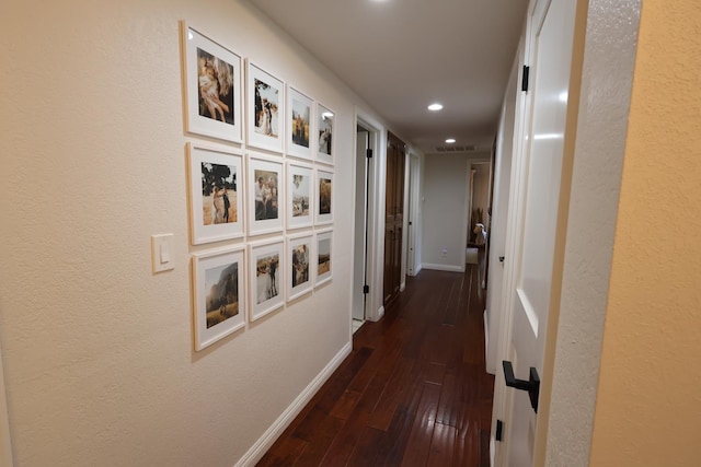 2210 W Spruce Ave, Fresno, CA 93711 - corridor featuring baseboards, recessed lighting, dark wood-type flooring, and a textured wall