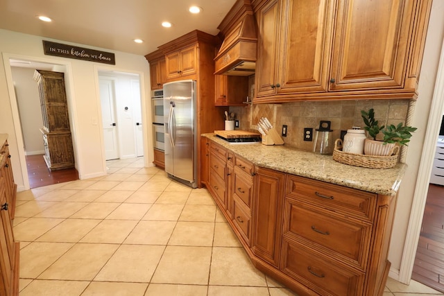 2210 W Spruce Ave, Fresno, CA 93711 - kitchen featuring stainless steel fridge, custom exhaust hood, multiple ovens, recessed lighting, and gas stovetop