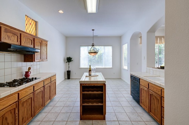 2671 E Eclipse Ave, Fresno, CA 93720 - kitchen featuring black appliances, under cabinet range hood, tile counters, tasteful backsplash, and recessed lighting