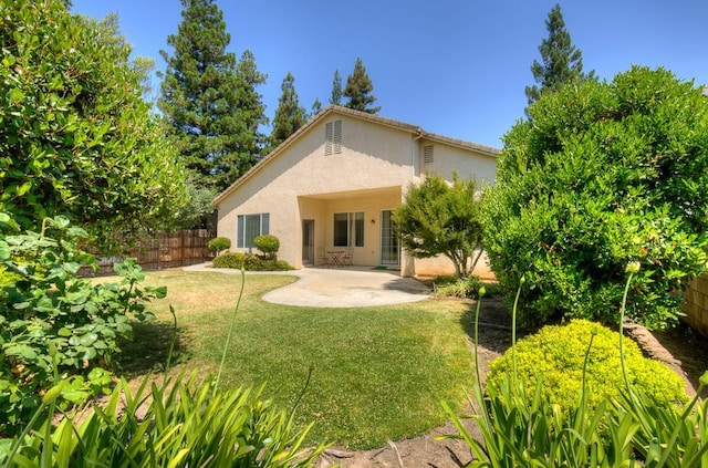 2671 E Eclipse Ave, Fresno, CA 93720 - back of property with stucco siding and a patio