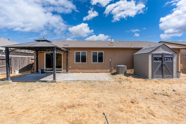 5576 E Burns Ave, Fresno, CA 93727 - rear view of property with a gazebo, a patio area, a fenced backyard, stucco siding, and central AC unit
