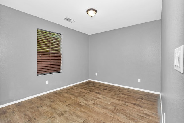 5576 E Burns Ave, Fresno, CA 93727 - empty room featuring baseboards and wood finished floors